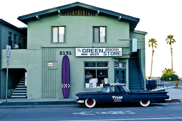 Broza and Tyler came up with this concept after Tyler finished Broza’s purple “777.” This shot was done at 6am before the 22nd parking spots were filled. Tyler Surfboard’s Shoprat Josh Gilberts is behind and holding the un-waxed surfboard.