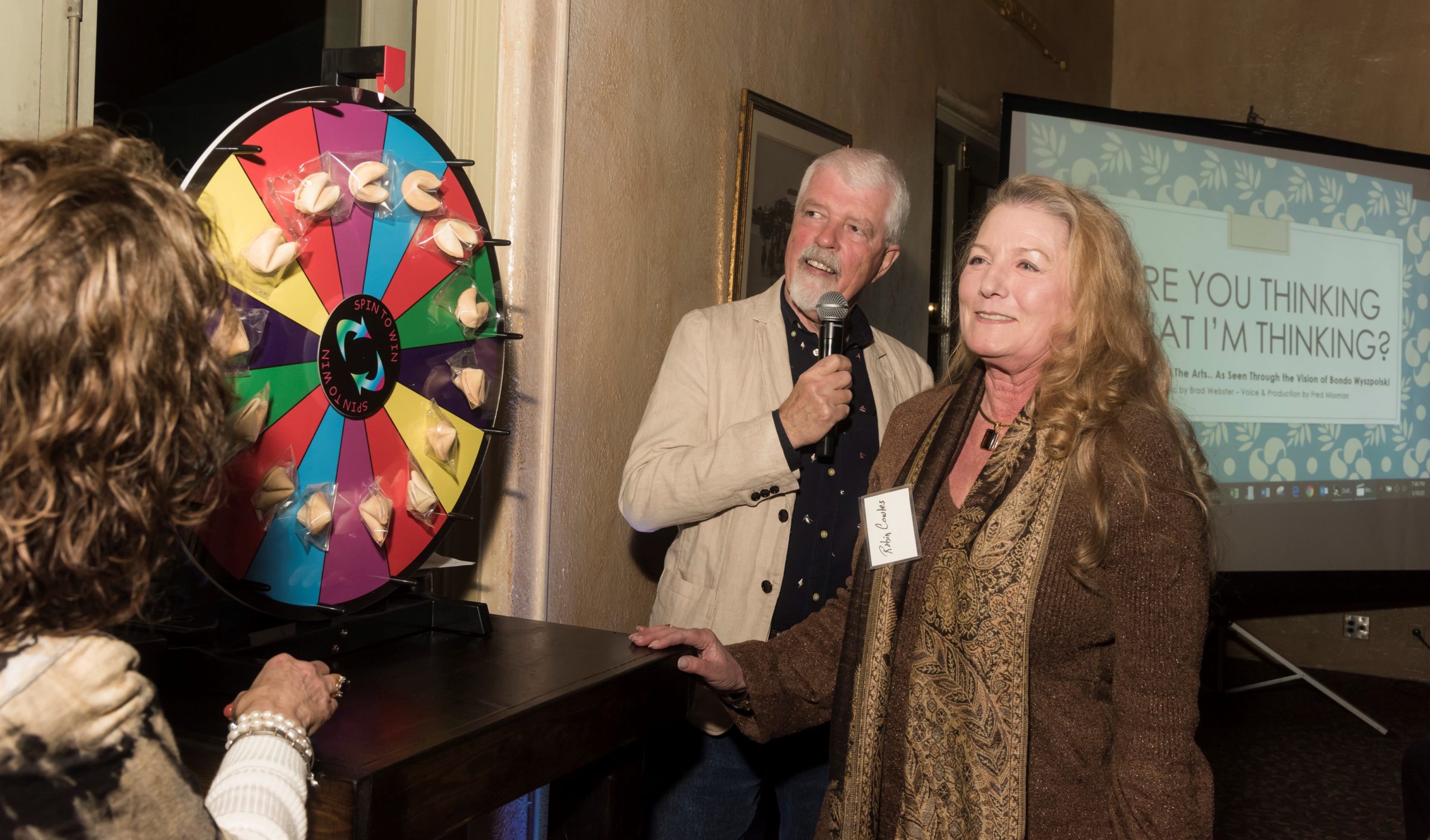 The picture’s title? Spin the wheel,  open the fortune cookie, and then they will find out!