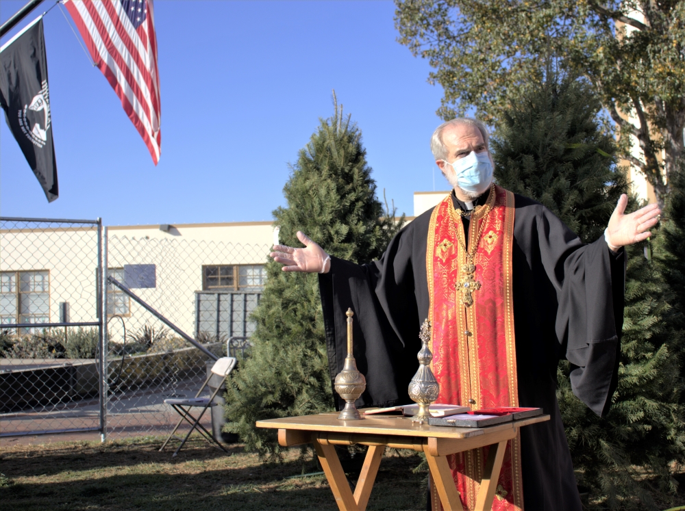 Greek Orthodox Rev. Michael K. Courey blesses Hermosa Kiwanis holiday tree lot