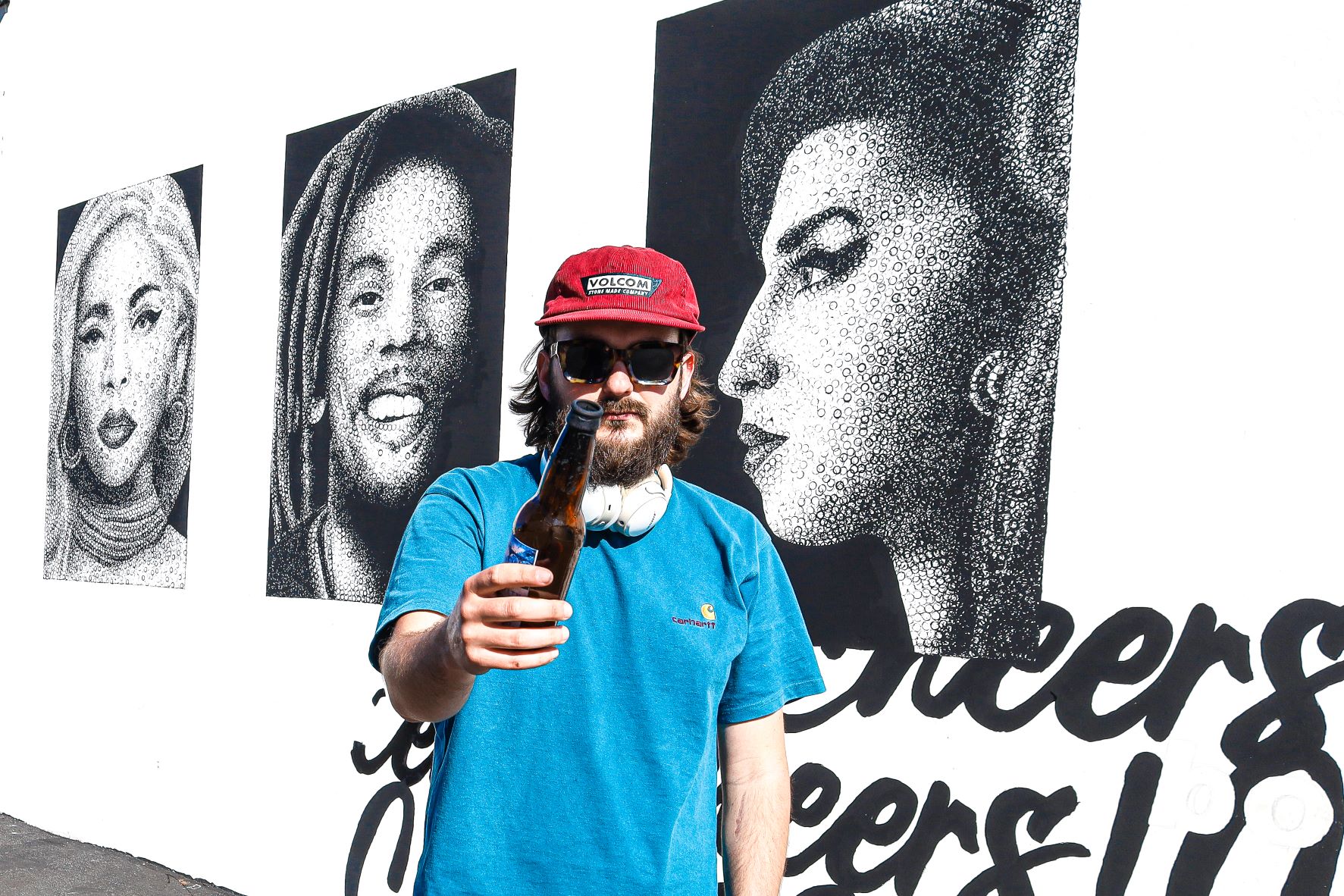 Muralist, Nicolas Thollot Arsac (aka Bottl3man) exchanges brush for beer bottles for HopSaint mural