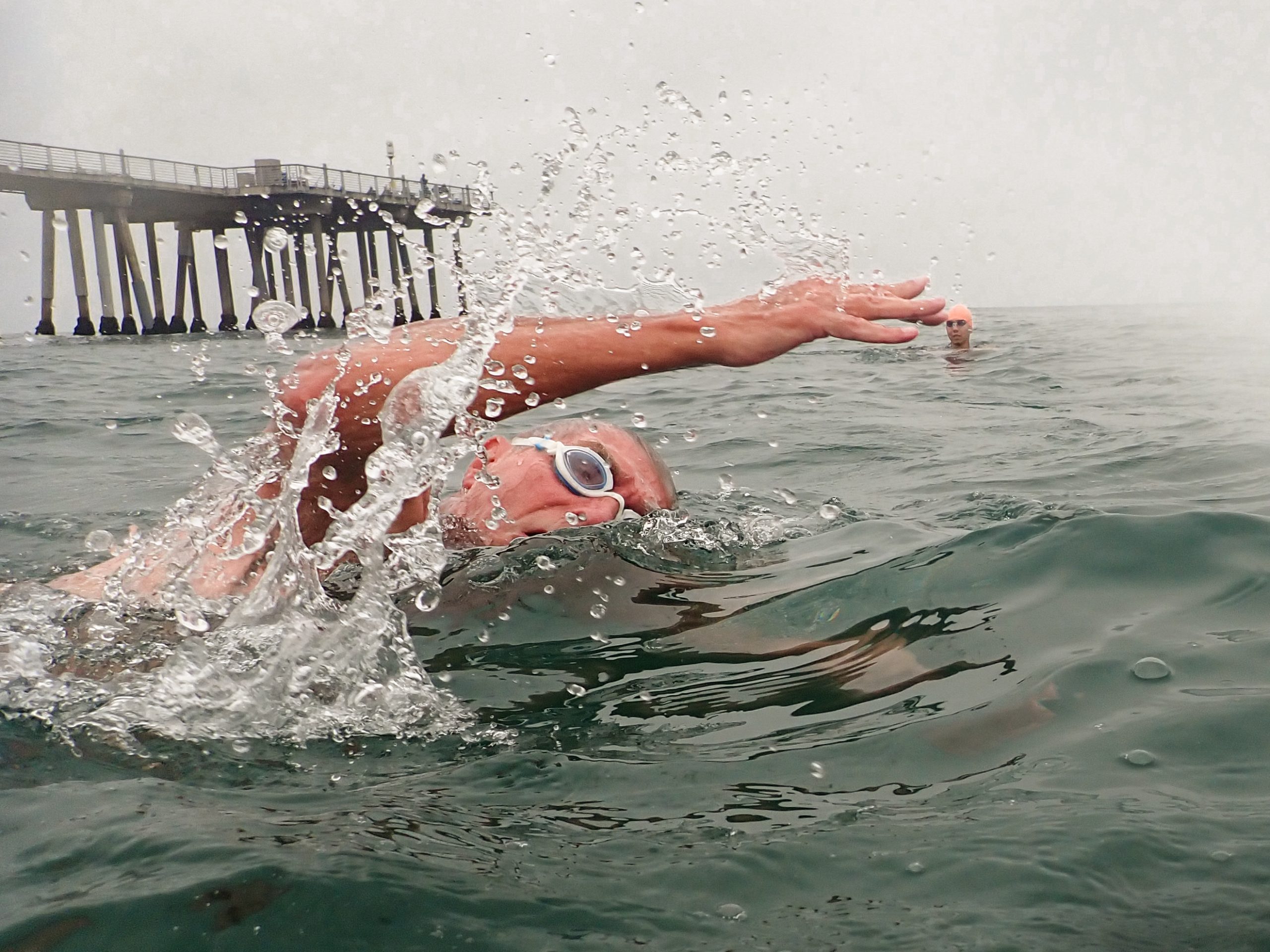 Swim coach Steve Hyde celebrates 76th birthday by swimming to the end of the Hermosa Pier, and back
